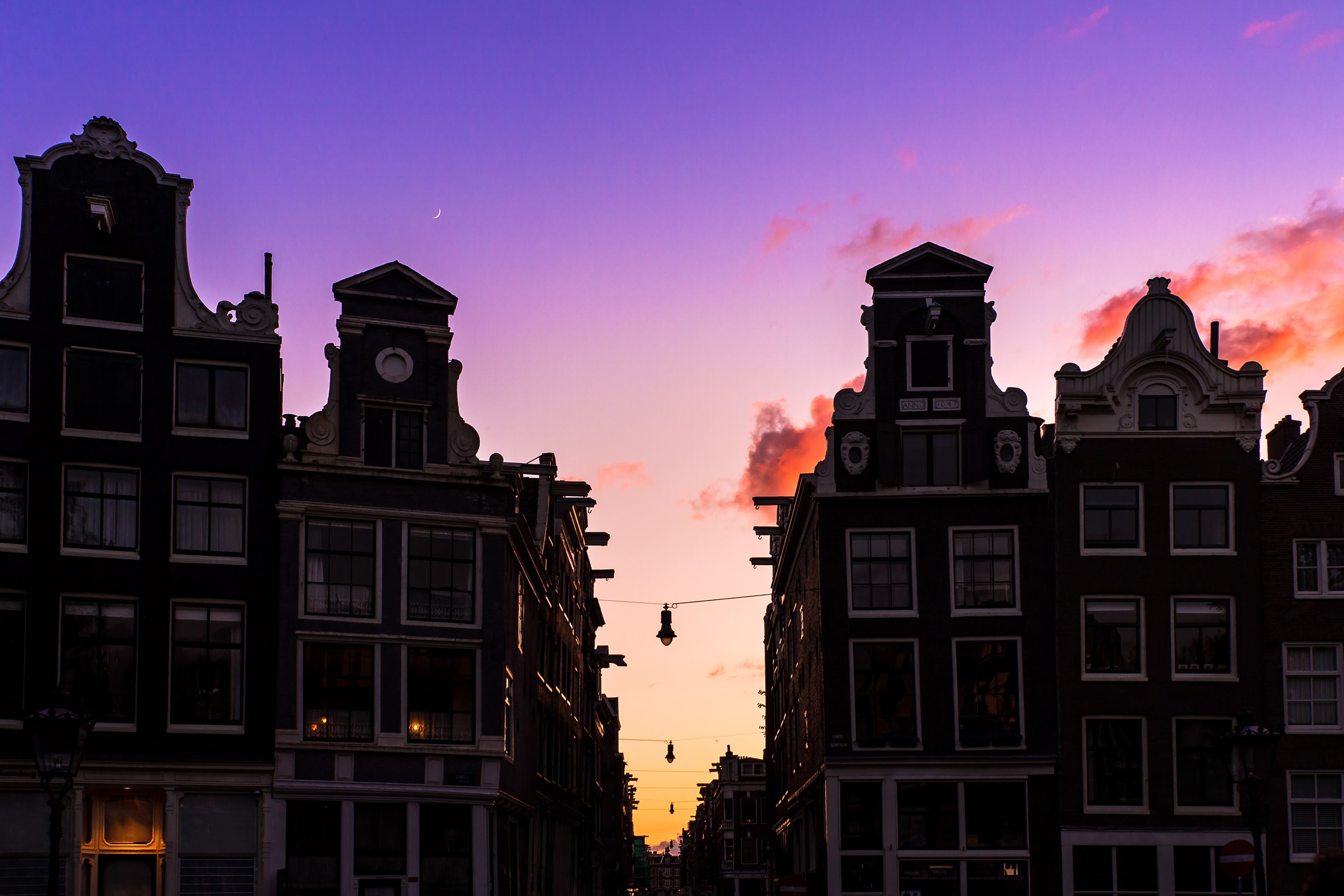 Beautiful silhouettes of canal houses at the little nine streets in Amsterdam, the Netherlands, at sunset