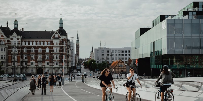 People ride their bikes in Copenhagen, Denmark