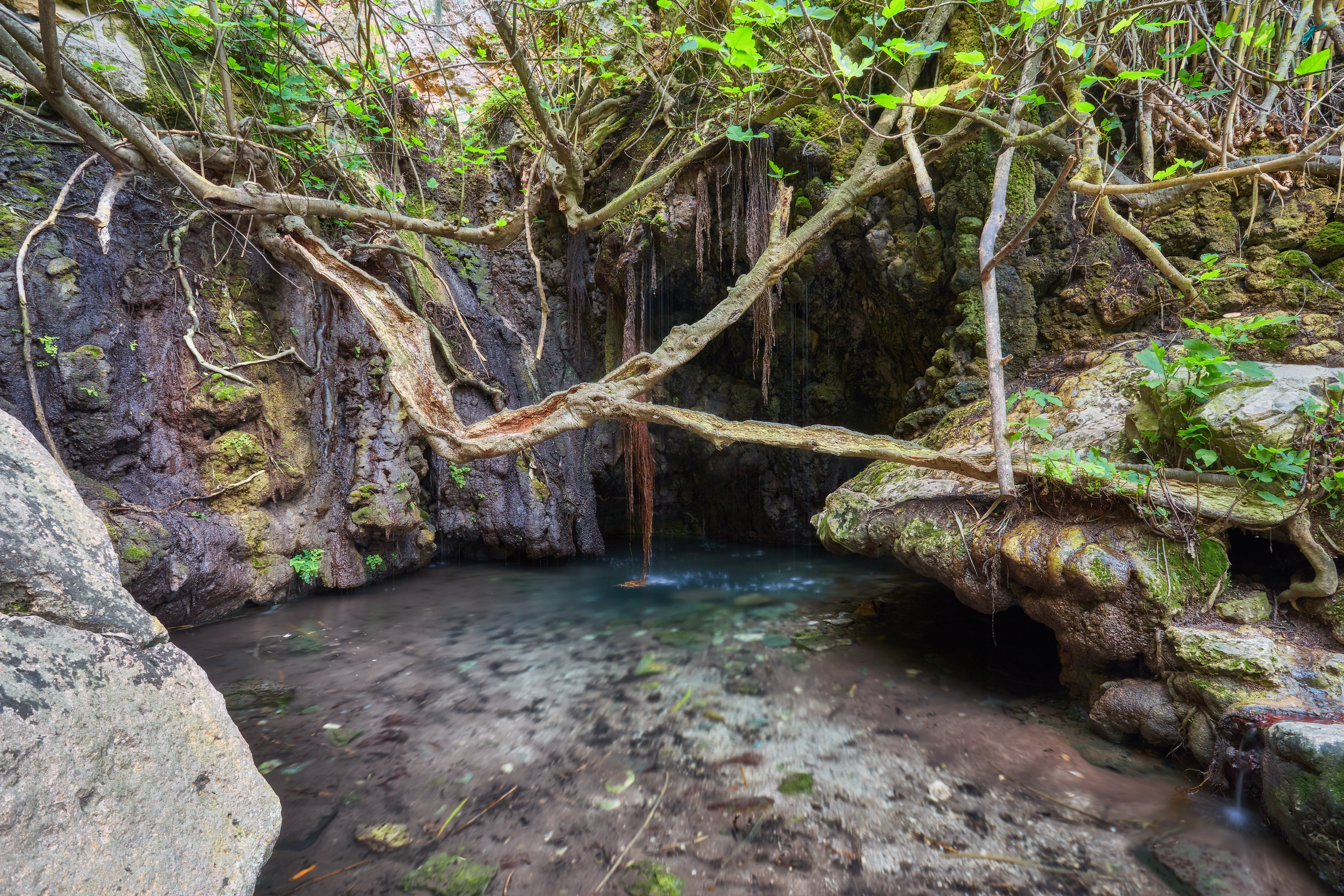 Baths of Aphrodite Grotto with pond and water spring
