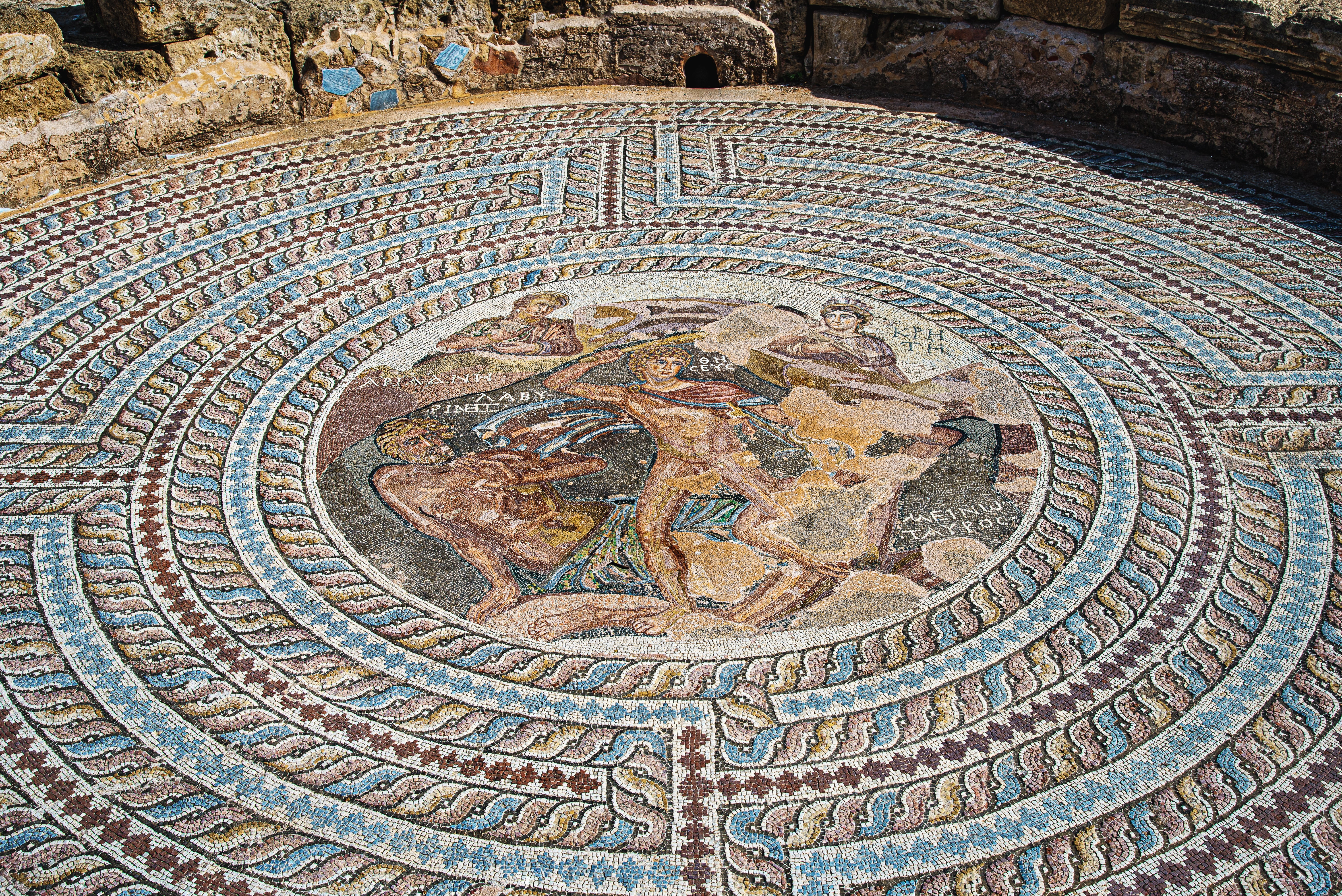 Mosaic image of the duel between Theseus and the Minotaur. House of Theseus. Paphos Archaeological Park