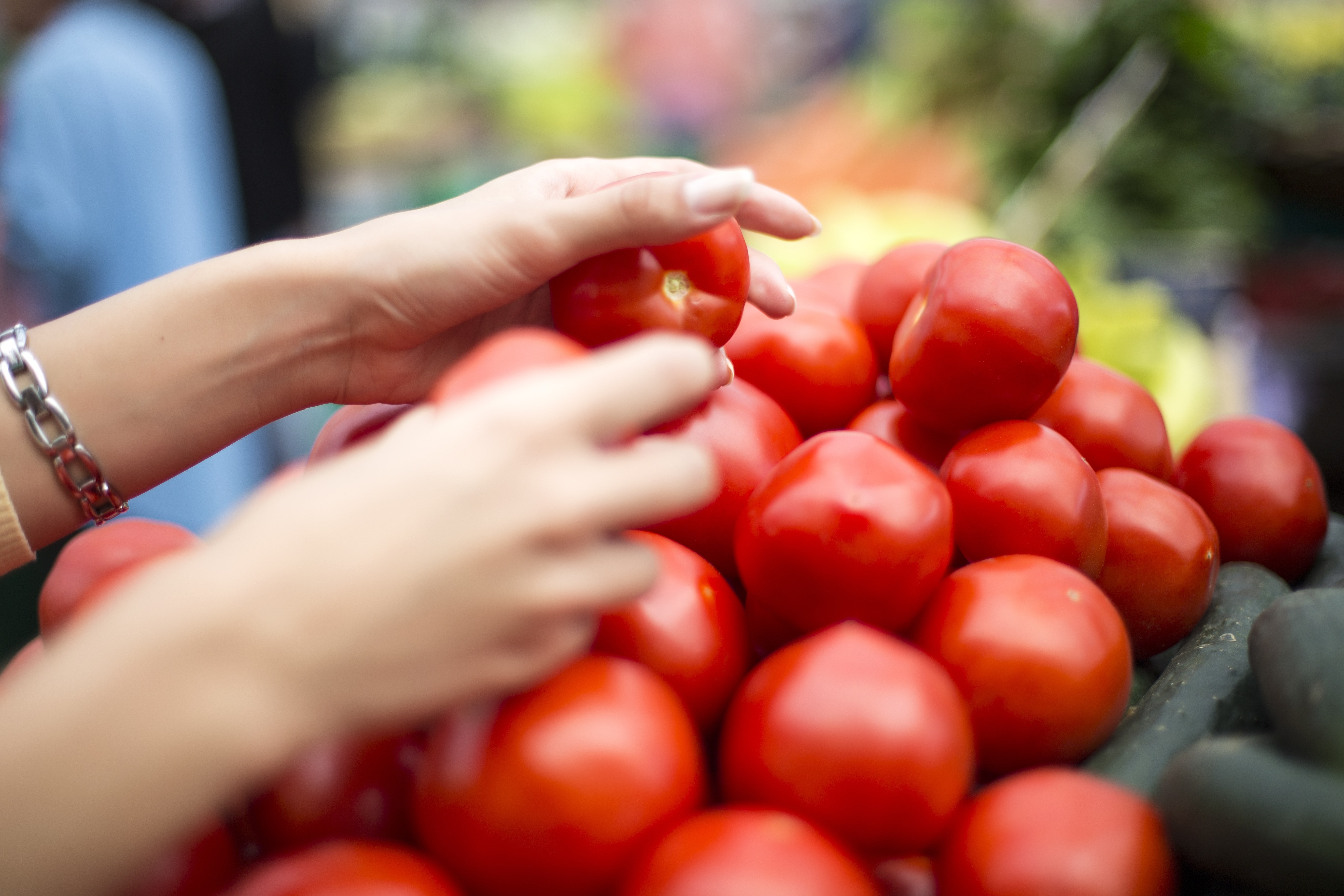 Woman buying fresh vegetables on the market