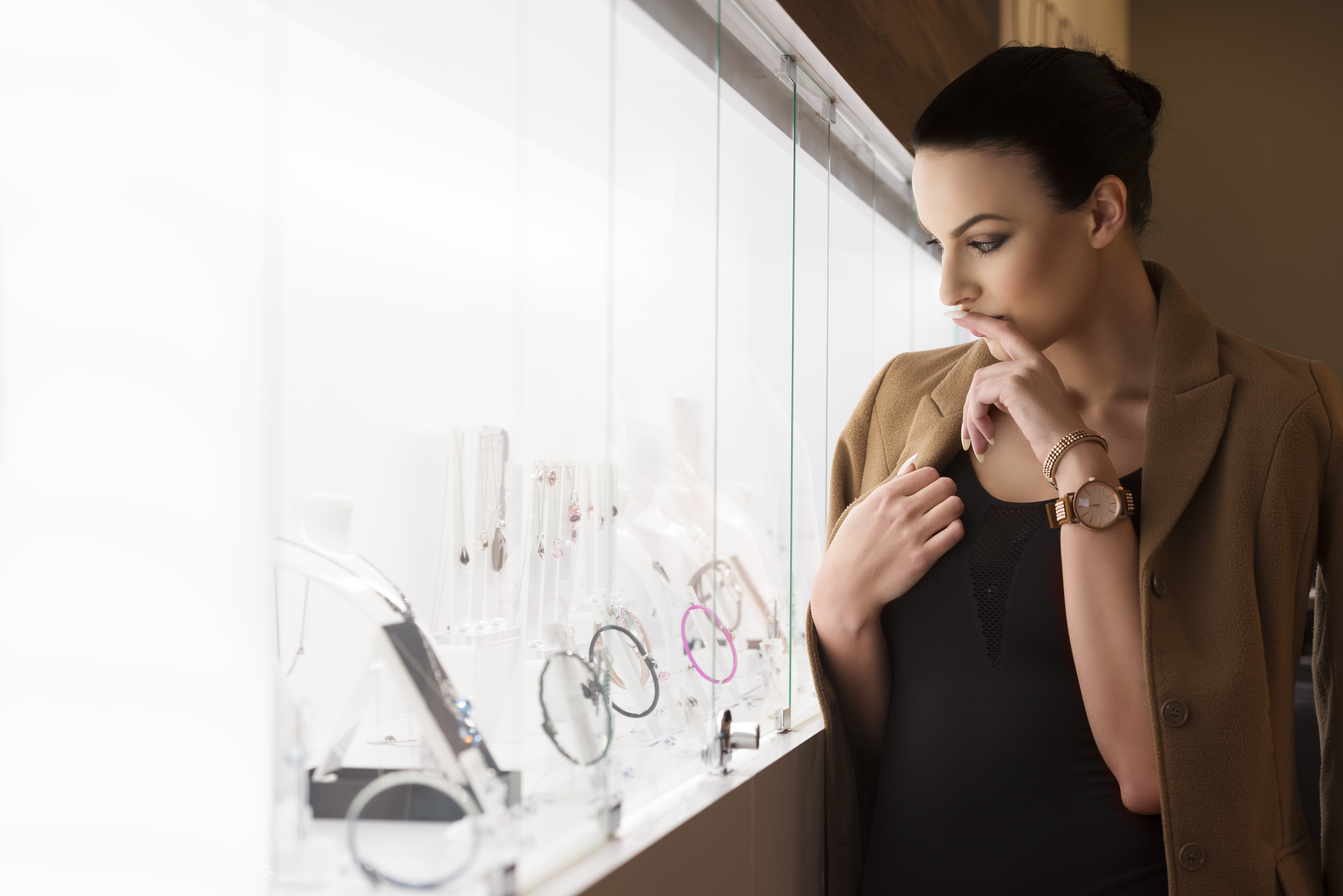 womann looking at a jewellery window shop